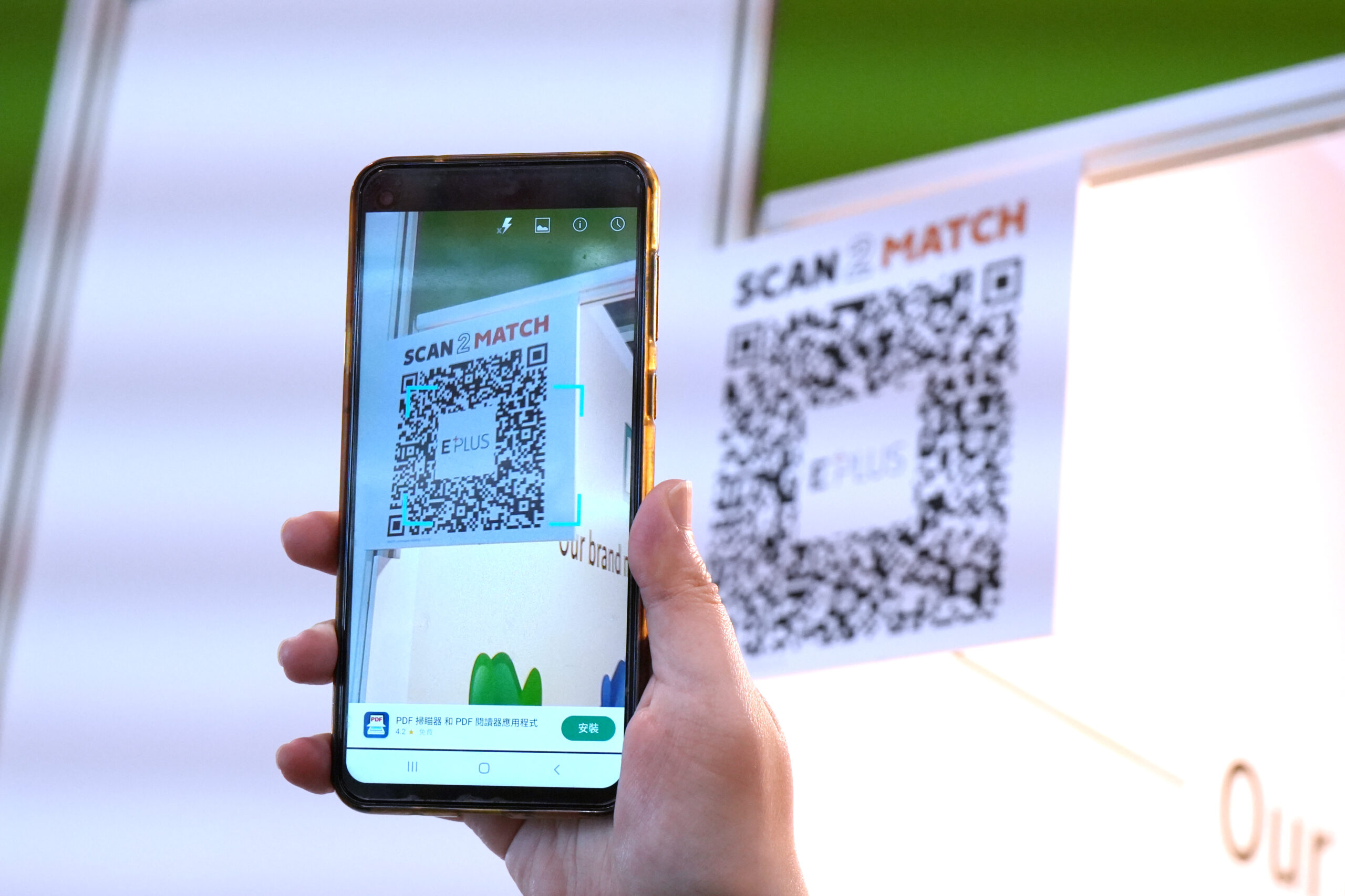 Visitors trying out the Scan2Match function at booths.