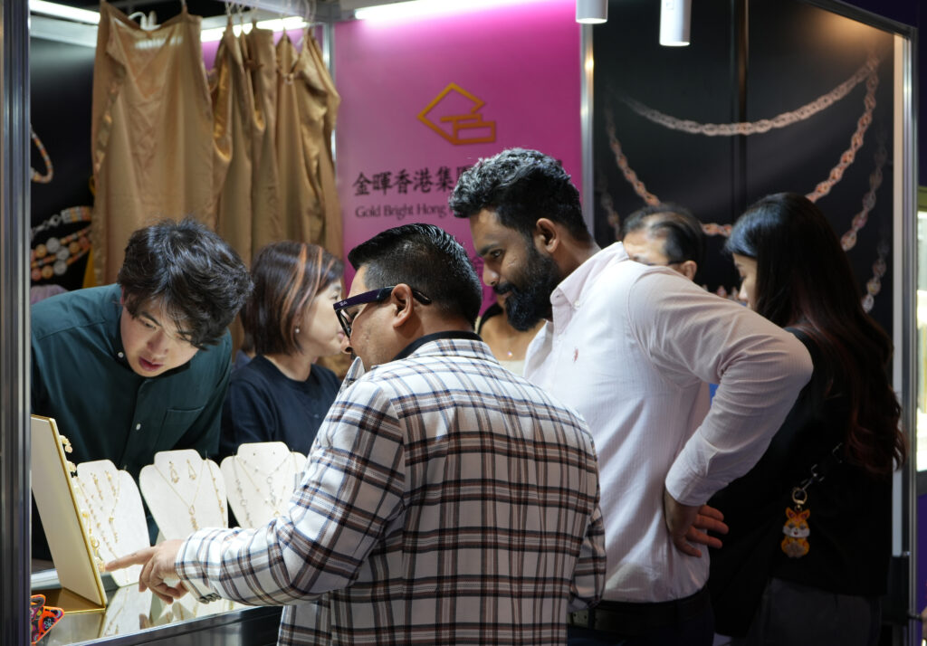 Some Indian buyers attracted to a jewellery store.